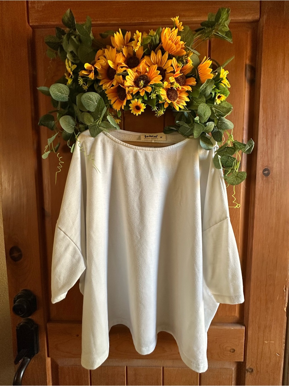 Three birds nest white top size medium batwing style top. One owner home.